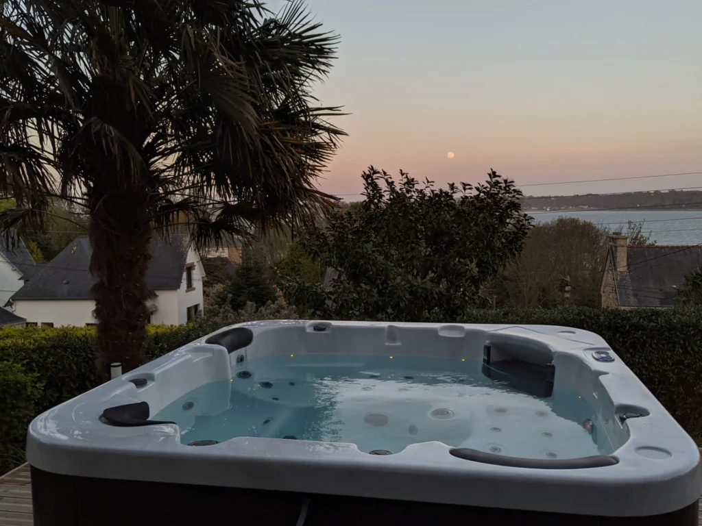 Built-in hot tub with bubbles and jets, at dusk